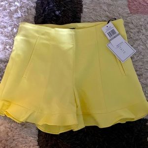1 State Size 0 yellow shorts with side zip NWT.. never wore. Little big for me